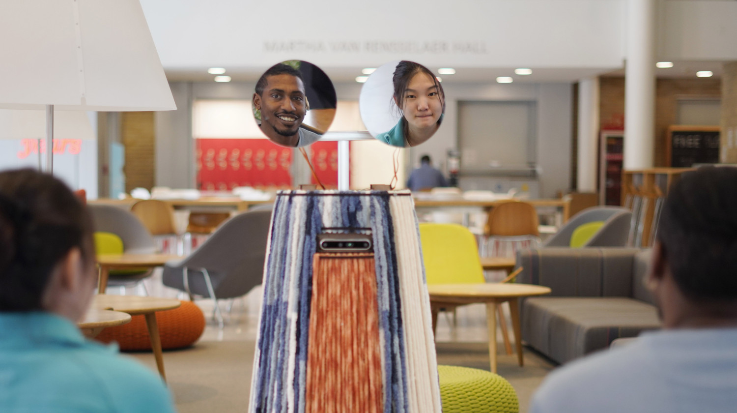 Robot with mirrors showing people's faces